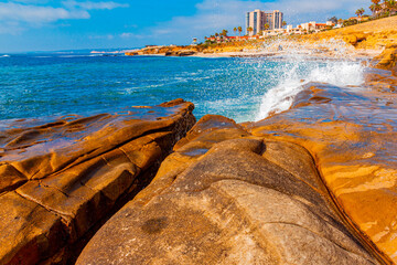 The La Jolla , California coast is filled with cliffs, boulders and crashing waves.