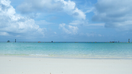 Fototapeta na wymiar Sea and sand with blue sky 