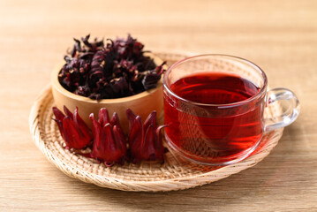 Roselle tea on wooden background, Healthy herbal drink
