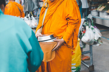 Thai monk ask for alms for buddhist to make merit