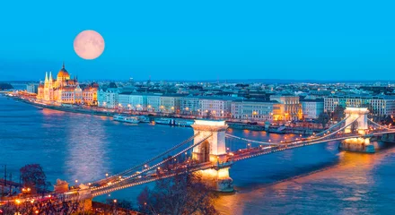 Wall murals Széchenyi Chain Bridge Hungarian parliament and Chain Bridge with full moon at twilight blue hour in Budapest "Elements of this image furnished by NASA"