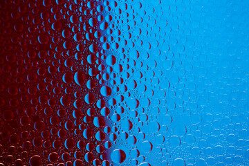 Abstract background of water droplets on the glass surface