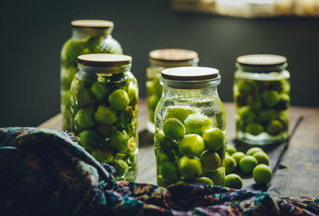 Several bottles of green plum drinks in glass bottles