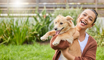 Meet my new yoga instructor. Portrait of an attractive young woman playfully holding her dog in the garden.