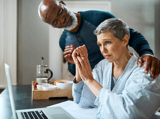 I know its stressful but Im here for you. Shot of a senior married couple stressed out doing their...