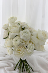 Stylish White wedding bouquet with ranunculus, roses, dianthus
