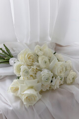 Stylish White wedding bouquet with ranunculus, roses, dianthus