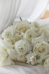 Stylish White wedding bouquet with ranunculus, roses, dianthus
