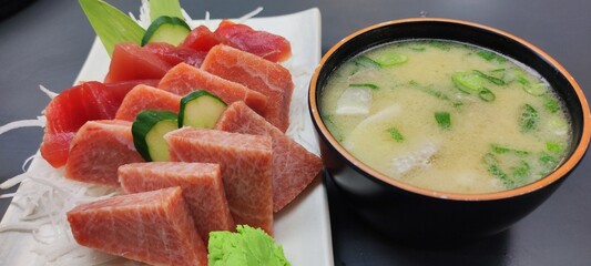 The Premium fresh Japanese seafood sashimi set in black Japanese bowl with miso soup,raw seafood