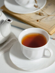 minimalistic white porcelain teapot and cups for tea drinking for two
