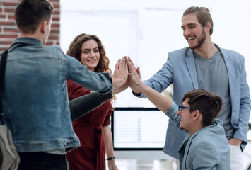 Business people happy showing team work and giving five