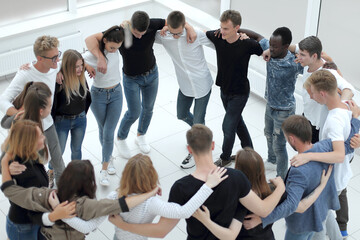 group of diverse young people applauding at the seminar