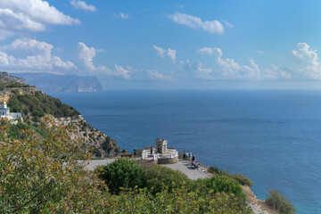 Pushkin's gazebo made of white stone over the gentle blue sea in the Crimea. High Cape Fiolent on a...