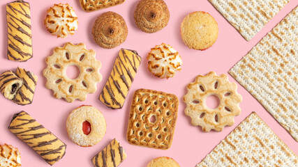 Various kosher pastries for Jewish holiday Pesach on pink background.