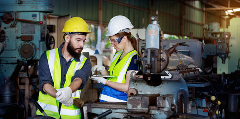 A team of professional male and female engineers with quality skills, inspecting, controlling, and maintaining machines