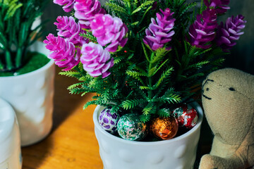 Horizontal view of small Easter eggs and decorative flowers. Selective focus. Happy Easter.