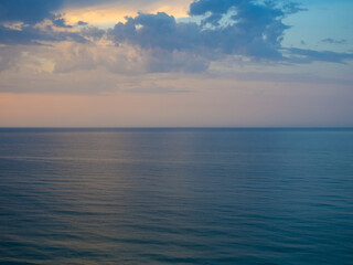 Obraz premium Morning landscape with cloudy sky and ripples at sea in Ukraine. Beautiful colorful seascape. Wide deep blue sea ocean ripples. Nautical background