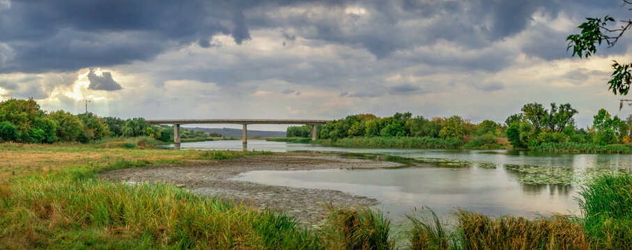Dark rain clouds over the Southern Bug river