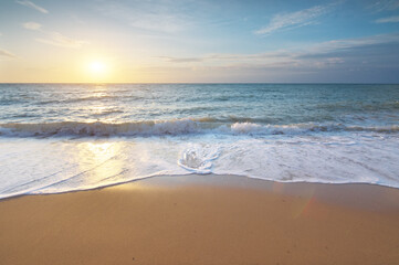 Fototapeta na wymiar Sandy seashore at sunset