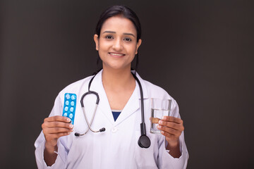 young doctor woman showing blank screen of smartphone 