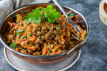 Green lentils stew with white wine, Serrano ham and smoked paprika