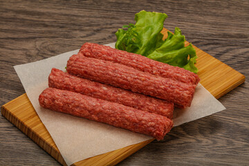 Raw beef sausages with spices