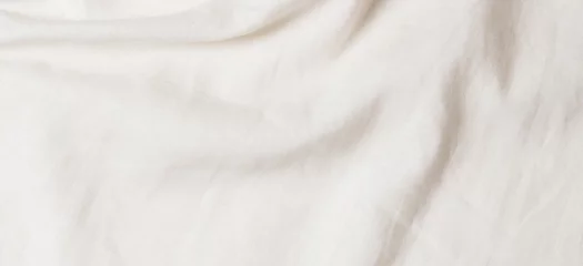 Rolgordijnen White crumpled linen fabric texture background. Natural linen organic eco textiles canvas background. Top view © vejaa