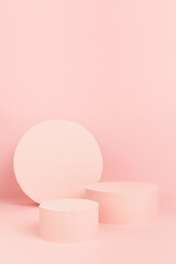 Modern geometric pastel pink stage with circle two podiums, round decoration mockup on soft light color, copy space, vertical. Template for advertising, presentation cosmetic products, goods, design.