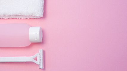 Items for personal hygiene on a pink background