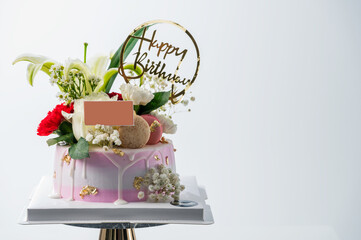 Birthday cake with flower macarons. food anniversary concept cover banner background