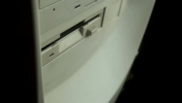 Inserting EXE Program Start Up File on Floppy Disk Into PC Computer Drive, Close Up