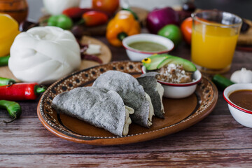 Mexican quesadillas with cheese and salsa sauce traditional food in Mexico
