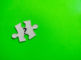 Puzzle pieces with question mark symbols.