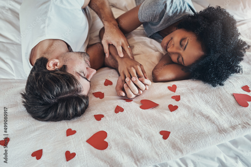 Poster Youre all I need in this world. Shot of an affectionate young couple spending some quality time together in their bedroom at home.