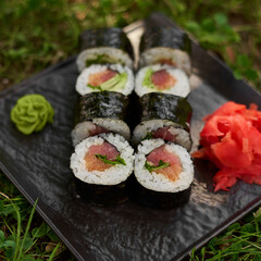 Bright sushi on a background of grass