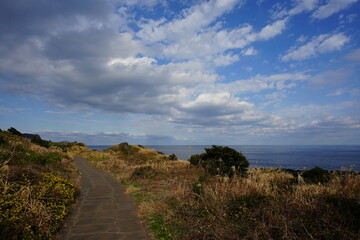 seaside walkway and charming clouds