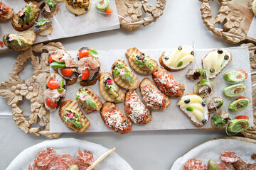 Delicious canapes with a variety of fillings. Tasty buffet table. Catering concept