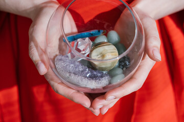 agate, amethyst, rock crystal, onyx. gem in female hands