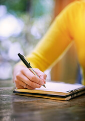 Write because your thoughts need a place to go. Cropped shot of a woman sitting at a table and...