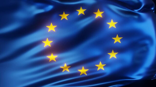 Waving European flag close-up on a dark background in slow motion.