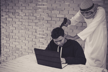 Terrorist using gun threaten hacker for stealing personal data from internet.