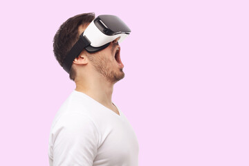 Banner of screaming young man in virtual reality VR glasses