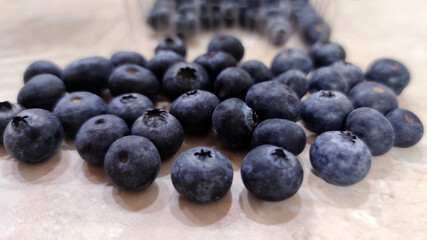 fresh blueberries scattered on the table close up