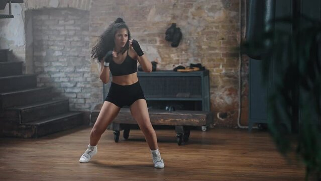 African American woman learns to fight at boxing classes