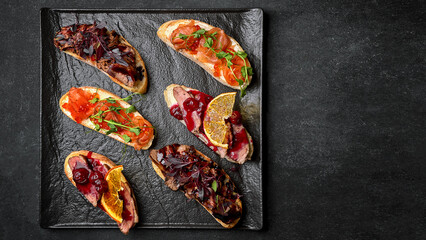 Bruschetta with meat and salmon with red caviar