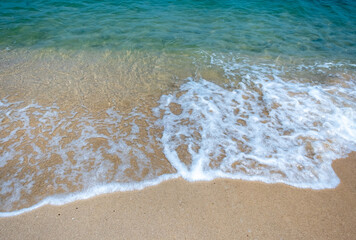 Golden sand and clear water of a beach on Koh Chang island in Thailand