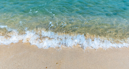 Golden sand and clear water of a beach on Koh Chang island in Thailand