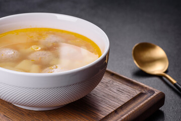 Soup with turkey meatballs, potatoes and vegetables. Selective focus