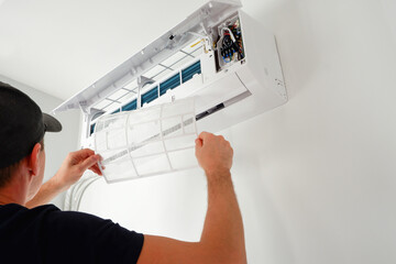 Air conditioner service. The technician checks the operation of the air conditioner. Filter...