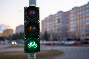 Traffic green light letting bicycle to pass in public place. Green light gives cyclist priority...